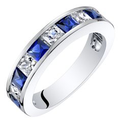 a white gold ring with blue sapphire stones