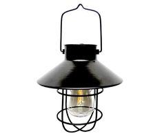 an old fashioned black hanging light on a white background