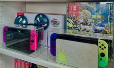 some nintendo wii game controllers are on display in a store with other games and accessories