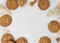 several cookies and oats on a white surface with an empty space in the middle