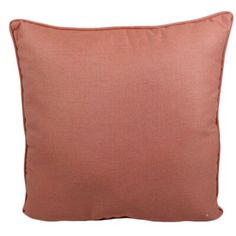 a peach colored pillow with an orange border on the front and back, sitting against a white background