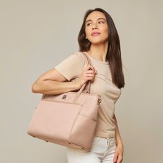 This structured tote is made from lightweight oxford fabric that's durable and water-resistant, featuring our signature 4-way-wear modes that you love, fits 15" laptops, and now you can easily slide it over your luggage. It’s the perfect carryall for work, travel, and anywhere your day brings you. Trendy Travel Laptop Bag With Luggage Sleeve, Trendy Laptop Bag With Luggage Sleeve For Travel, Pink Functional Laptop Bag For Travel, Functional Pink Laptop Bag For Travel, Pink Travel Bag With Laptop Sleeve, Trendy Laptop Bag For Travel, Everyday Pink Bag With Laptop Sleeve, Pink Laptop Bag For Everyday Use, Pink Functional Travel Diaper Bag