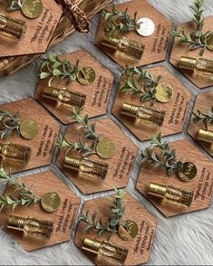 twelve wooden tags with gold and green leaves on them