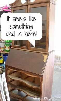 an old wooden desk with a speech bubble saying it smells like something died in here