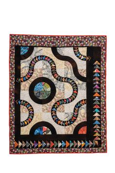 a black and white quilt with an abstract design on the center, surrounded by circles