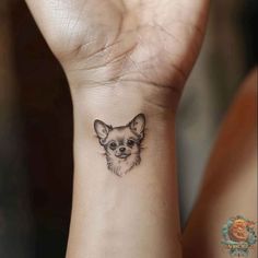 A charming Chihuahua tattoo on the wrist, perfect for those who love small dog tattoos. This design is both adorable and meaningful, making it an excellent choice for a dog memorial tattoo. 🐾 Find more at inktat2.com. Small Tattoo Dog Ideas, Small Dog Tattoos Chihuahua, Tattoo Idea Dog, Dog Wrist Tattoo, Chiwawa Tattoo, Dog Tattoo Chihuahua, Fun Dog Tattoo, Small Tattoos Dog