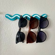 Get your sunglass situation together with this retro and colorful organizer that mounts to your wall with the INCLUDED command strips which can hold up to 4 pairs of sunglasses. It can also hold jewelry. Pick from our endless color options for an infinite amount of combos to find the perfect option that matches your home's vibe!! 🔨 Installation: (requires a drill and a 3/16" drill bit--screws are not included). However, we command strips are INCLUDED making it renter-friendly :) 📐 Dimensions: Sunglasses Rack, Star Background, Sunglass Holder, Command Strips, Best Practice, Renter Friendly, Drill Bit, Eyewear Sunglasses, Sunglasses Accessories