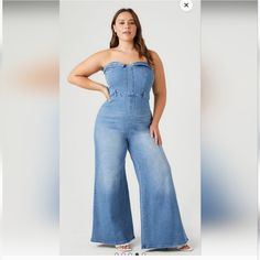 Crafted From Stretch Denim, This Jumpsuit Features A Fold Over Sweetheart Neckline, Strapless Cut, Belt Loops, Back Welt Pockets, A Wide Leg, And Exposed Back Zipper. 65% Cotton, 30 % Polyester, 5 % Spandex Machine Wash Cold Model Is 5 7 In Wearing A Size 2x Casual Medium Wash Fitted Strapless Jumpsuit, Casual Fitted Medium Wash Strapless Jumpsuit, Medium Wash Fitted Strapless Jumpsuit Casual, Casual Fitted Strapless Jumpsuit Medium Wash, Casual Medium Wash Strapless Jumpsuit For Spring, Casual Strapless Jumpsuit In Medium Wash For Spring, Casual Strapless Jumpsuit For Spring In Medium Wash, Casual High Rise Strapless Jumpsuit For Spring, Fitted Strapless Jumpsuit In Medium Wash For Spring