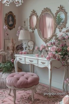 a room with pink flowers and mirrors on the wall next to a white vanity table