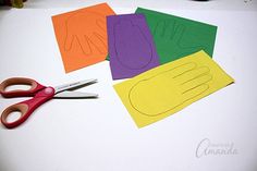 paper cut out to look like handprints and scissors