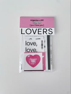 the packaging for love is shown in pink and white