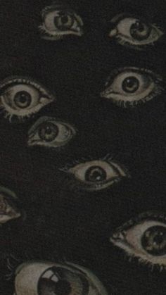 an image of many eyes in the dark