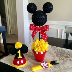 mickey mouse and minnie mouse birthday decorations on a table