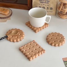 some cookies and a cup on a table