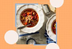 two bowls of soup on a table with spoons and napkins next to each other