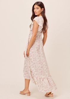 Cute Flutter Sleeve Floral Wrap Maxi Dress | LOVESTITCH Feminine Tiered Skirt Maxi Dress For Beach, Feminine Tiered Maxi Dress For Beach, Chic Flowy Boho Dress With Ruffles, Summer Sundress With Flutter Sleeves, Feminine Flowy Maxi Dress For Garden Party, Beach Maxi Dress With Short Sleeves And Ruffle Hem, Beach Maxi Dress With Ruffle Hem And Short Sleeves, Feminine Flowy Skirt Maxi Dress With V-neck, Bohemian Tiered Maxi Dress For Brunch