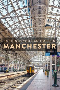 a train station with a sign that says 10 things you can't miss in manchester