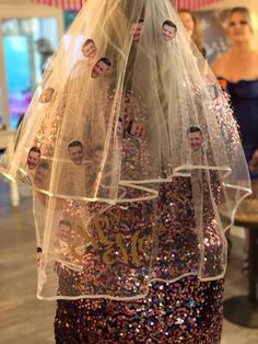 a dress made out of sequins with pictures of people on the front and back