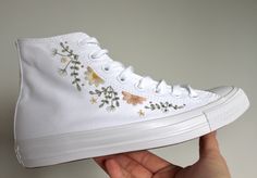 A pair of all white Converse canvas high tops embroidered with sprigs of eucalyptus, gypsophila and daisies.  You can either choose to have the outside leg (along eyelet seam), inside leg (wreath around badge) or both.  Please let me know if you'd like slightly different colour flowers or threads - these can be swapped to suit your desired colour palette of required.  Please ensure when selecting your size it is the correct one - you are responsible for ensuring you have selected the correct siz Platform Converse High Tops, Converse Platform High Top, All White Converse, Personalized Converse, Embroidered Converse, Cute Converse, Converse Platform, High Top Converse, Preppy Shoes