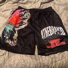 This Is A Dope Pair Of Graphic Mesh Shorts Comfy But Ran Small Tag Says Xl But Fit Like A Large Never Worn But Took Tags Off Black Pants With Built-in Shorts For Summer, Black Letter Print Pants For Summer, Black Sports Pants For Summer, Black Letter Print Shorts For Spring, Multicolor Letter Print Bottoms For Streetwear, Summer Black Pants With Graphic Print, Casual Multicolor Bottoms With Letter Print, Black Short Bottoms With Letter Print, Black Graphic Print Bottoms For Summer