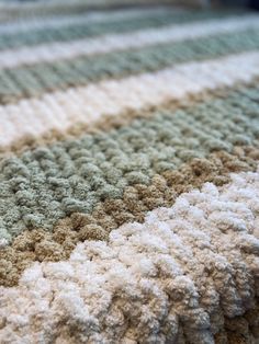 a close up view of a blanket that is made to look like it has been crocheted