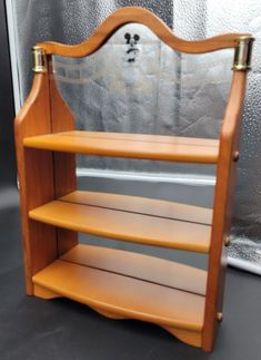 a wooden shelf with three shelves on each side