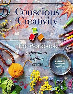 the cover of conscious creativity magazine, featuring various crafting tools and flowers on a wooden table