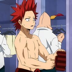 a shirtless man with red hair standing in front of a mirror and looking at himself