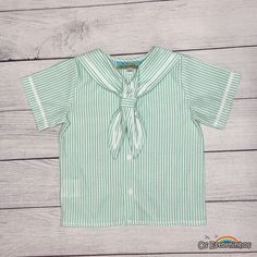 Boy sailor shirt - Boy Striped Short Sleeve Shirt with Sailor Collar - Nautical Style Top Dress your little one in this adorable baby striped short sleeve shirt, featuring a charming sailor collar. Perfect for summer events and nautical-themed occasions, this shirt combines classic sailor style with modern comfort. - Exterior: 50% Cotton, 50% polyester  [Sizes ] Please check the measurements I use to make the pieces on the listing photos. Any questions please contact me. [ Production time ] All Green Shirt For School In Summer, Cotton Sailor Top With Sailor Collar, Summer Marine Style Cotton Tops, Marine Style Cotton Tops For Summer, White Nautical Cotton Shirt, White Short Sleeve Nautical Shirt, Summer Sailor Style Short Sleeve Tops, Nautical Short Sleeve Top In Sail Color, White Sailor Top For Summer