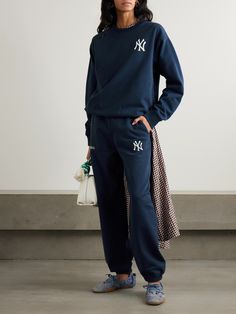 Few labels approach athleticwear with the same confidence as Sporty & Rich, making its collaboration with '47 & The New York Yankees feel like a perfect fit. These sweatpants are made from comfortable cotton-jersey that's embroidered with both logos and have an elasticated waist and hems. Luxury Sporty Sweatpants For Women, Luxury Sporty Sweatpants With Pockets, Sporty And Rich Sweatpants, Sporty And Rich Crewneck, Sporty Cotton Sweatpants With Logo Detail, Tapered Sweatpants, Rich Clothes, Rich Women, Sporty And Rich