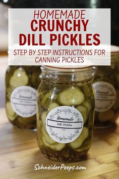 three jars filled with pickles sitting on top of a wooden table next to a sign that says homemade crunchy dill pickles