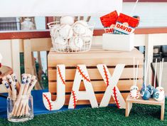 a baseball themed birthday party with cake pops and candy sticks on the side of a bench