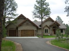 a large house with two garages in the front