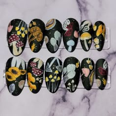 Set of matte, hand-painted, almond shaped press-on nails with a mushroom print design, and gold flakes over a dark green base.  Comes with 1 sheet of nail adhesive tabs (24 pcs). -Sets of 22 are ready to ship (unless they are sold out), and do not require any sizing (includes all possible sizes X2). -If you wish to purchase this design in a different shape or length (either the full set of 22, or set of 10), please message me prior to purchasing so I can accommodate  Please do not order sets of Green Mushroom, Witchy Nails, Cottagecore Dark, Mushroom Forest, Mushroom Print, Really Cute Nails, Almond Shaped, Manicure Y Pedicure, Gold Flakes