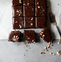 pieces of chocolate cake with nuts on top