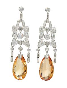 A pair of Art Deco topaz and diamond earrings, 1920s. A pair of golden topaz briolettes are suspended from chandelier earrings set with old European and baguette diamonds totalling approximately 5 carats mounted in platinum. Aquamarine Diamond Earrings, Fine Jewlery, Art Deco Jewellery, Vintage Jewelry Art, Imperial Topaz, Baguette Diamonds, Art Deco Necklace, Topaz Earrings, Art Deco Earrings