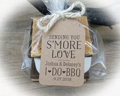 some cookies wrapped in plastic and tied to a string with a tag that says sending you s'more love