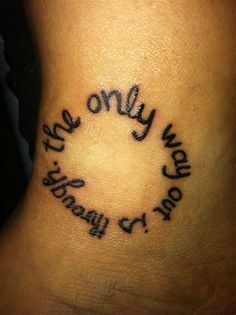 a tattoo that says, the only way to stay on is in a circle with words