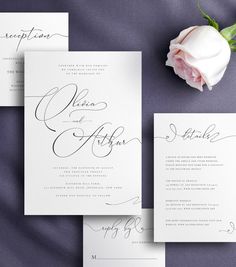 the wedding stationery is laid out on top of each other, with a single rose