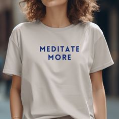 ❤ MEDIATATE MORE ❤ Yoga shirt Experience ultimate comfort and inspire tranquility with our "Meditate More" T-shirt, specially designed for yoga and Pilates enthusiasts. Crafted from soft material that gently caresses the skin, this shirt seamlessly combines comfort with style. The "Meditate More" imprint not only makes a fashion statement but also serves as a reminder to focus on the essential. Perfect for your yoga and Pilates practice, this shirt provides unrestricted movement and a delightful Relaxed Fit Crew Neck T-shirt For Relaxation, Relaxed Fit Graphic Print Tops For Meditation, Comfortable Relaxed Fit T-shirt For Relaxation, Relaxed Fit Yoga T-shirt With Letter Print, Comfortable Cotton Yoga Tops, Relaxed Fit Letter Print T-shirt For Yoga, Casual Moisture-wicking T-shirt For Yoga, Relaxed Fit T-shirt With Letter Print For Yoga, Cotton Relaxed Fit T-shirt For Yoga