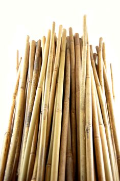 a bunch of bamboo sticks stacked on top of each other