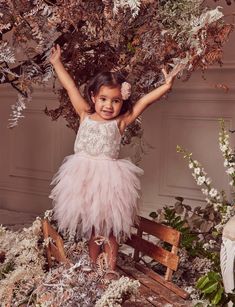 She has the face of an angel, so this festive season, give her the gift of a dress to match. The Bébé Frostine Tutu Dress takes luxe holiday dressing to another level with a shimmering bodice overrun by winding vines of gilded embroidery, bright beads and sparkling crystals to form perfectly petite flowers. Glorious waterfall layers of Porcelain Pink tulle cascade into a heavenly silhouette to finish the look. Adjustable straps ensure comfort and ease of wear. SIZE AND FIT We focus on creating g Festive Sleeveless Tulle Dress, Elegant Tulle Holiday Dress For Festive Occasions, Elegant Sleeveless Tutu Dress For Festive Occasions, Elegant Embellished Tutu Dress For Dress-up, Holiday Princess Tutu Dress For Dress-up, Elegant Festive Tulle Princess Dress, Elegant Festive Tulle Dress, Elegant Sleeveless Princess Dress For Festive Occasions, Elegant Festive Tutu Dress For Party