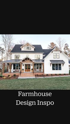 a large white house with black roof and windows