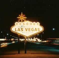 the welcome to las vegas sign is lit up at night