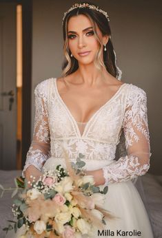 a woman in a wedding dress holding a bouquet