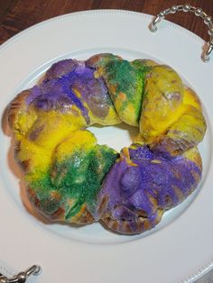 a rainbow bundt cake on a white plate