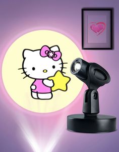 an image of a hello kitty projector on the wall next to a light fixture