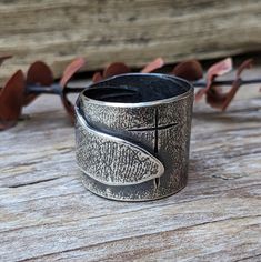 A primitive style Ring made with Argentium Silver. The heavy ring band has a light texture on the surface that I achieved by using lace and a rolling mill. I used chasing tools to carve the Cross. This ring has been oxidized to give it that Medieval look and to show off the texture. It is approximately a size 8.5. Rustic Silver Rings With Patina, Medieval Ring, Saint Simons Island, Medieval Rings, Rolling Mill, Eco Jewelry, Man Ring, Ring Man, Primitive Style