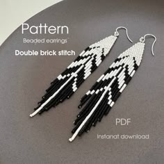 a pair of black and white beaded earrings