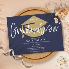 a graduation party card on top of a wooden plate